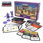 Masters of the Universe Battleground Evil Warriors expansion box with cards, minis and terrain on display.